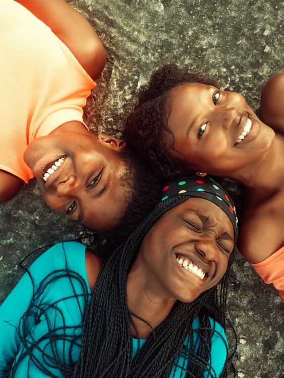 Three friends sharing a joyful moment together